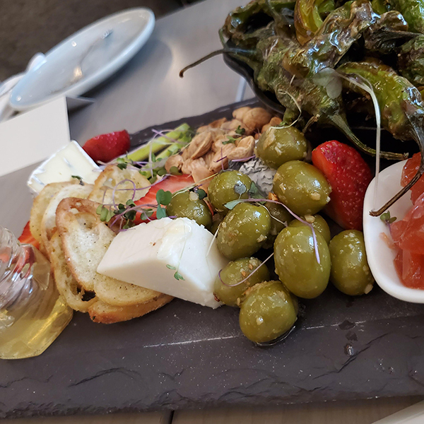 Calgary Bearspaw, Restaurant Flores and Pine charcuterie, platter olives honey peppers cheese
