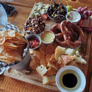 Banff Calgary restaurant Cliffhouse Bistro charcuterie preztels kettle chips olives